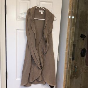 Ruffle trimmed long cardigan vest.